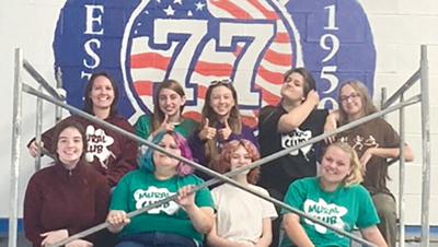 Northwest High School students with an in-progress mural.