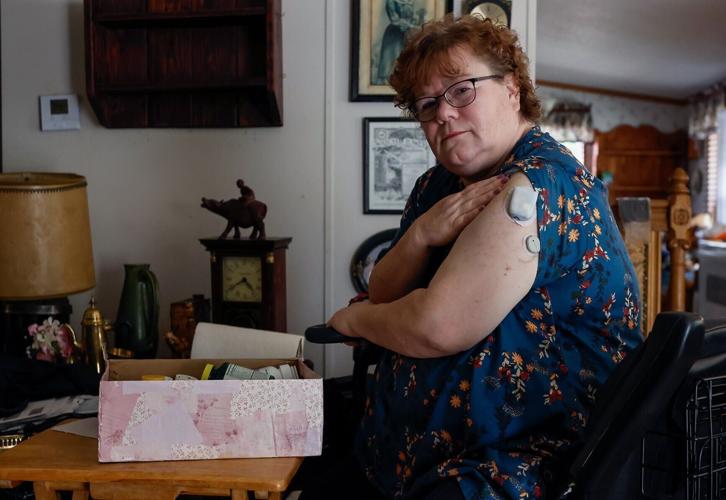 Malden Pharmacy patient Caroline Milam sits for a portrait