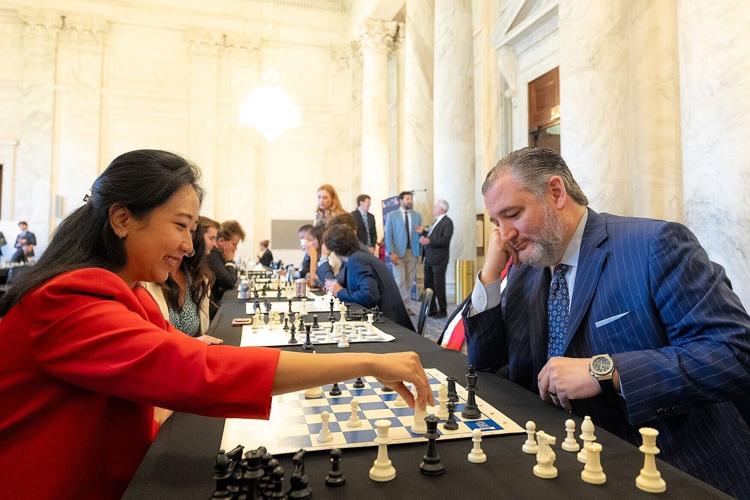 Sen. Ted Cruz, R-Tx., right, grimaces as grandmaster Irene Sukandar deals the final blow
