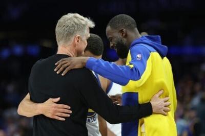 Head coach Steve Kerr, Stephen Curry and Draymond Green hug during the final moments of the Golden State Warriors' NBA play-in loss to the Phoenix Suns