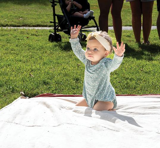 Kaia Neel, 10 months, of Festus participates in the baby crawling contest at Crystal City Park.