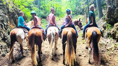 Faith Townsend of Festus sent in this photo of her and her horse, Dallas, second from right, along with a group of friends on a trail ride in June in Valles Mines. Her daughter, Megan Townsend of De Soto, who was riding her horse, Hailey, snapped the ph...