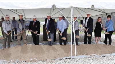 Officials participate in the groundbreaking ceremony for the forensic crime lab on May 6 in Pevely.