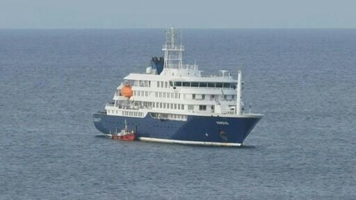 Ambulance boat arrives at virus-hit cruise ship for passenger evacuation
