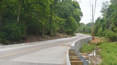 Crews built a special access for the natural spring to flow unencumbered under the new roadway.