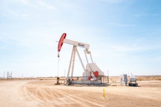 The benchmark international oil contract fell back under $100 per barrel