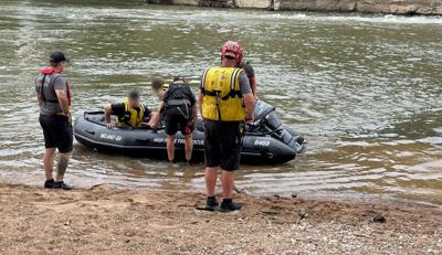 High Ridge Fire rescue woman, child and two men from Big River at Rockford Park