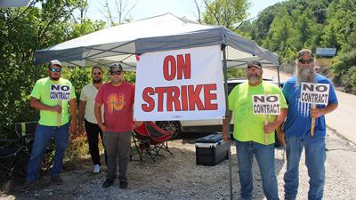 From left, Laborers Local 110 members Damien Rogers, Clinton McBride, Jeremy Webb, Mike Crostic and Tracy Harrell protest outside the Central Stone quarry in Antonia on July 11.