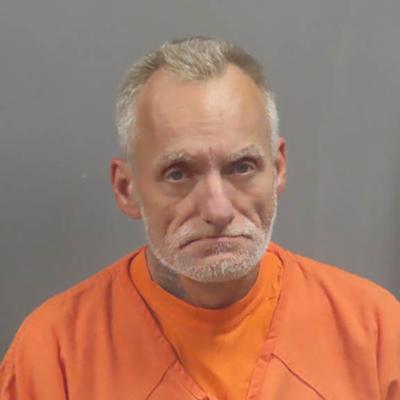 De Soto-area man accused of threatening woman with hatchet