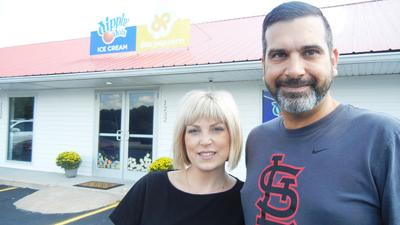 Marc and Andrea Yeida in front of the Dippin' Dots and popcorn shop they plan to open next week in Herculaneum.