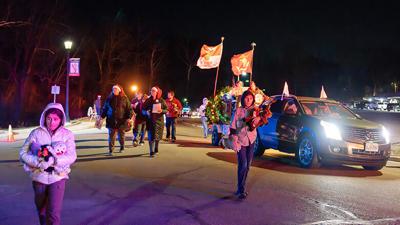 Toys for Tots members distribute stuffed animals to children Dec. 9 during the Pevely-Herculaneum Christmas Parade.