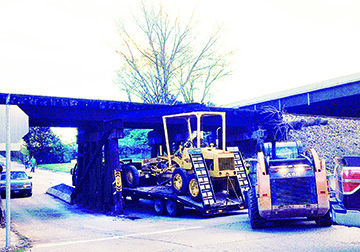Horine Road trestle struck by truck or object it was hauling.