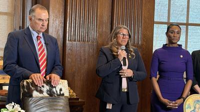 State Rep. Cecelie Williams, R-Dittmer, speaks about legislation that clarifies the right to divorce while pregnant. She is flanked by Gov. Mike Kehoe and state Rep. Raychel Proudie, a co-sponsor of the bill with Williams.