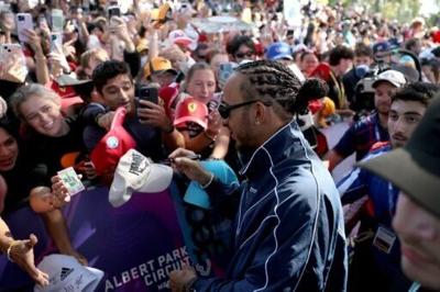 Ferrari's Lewis Hamilton greeted by fans in Melbourne
