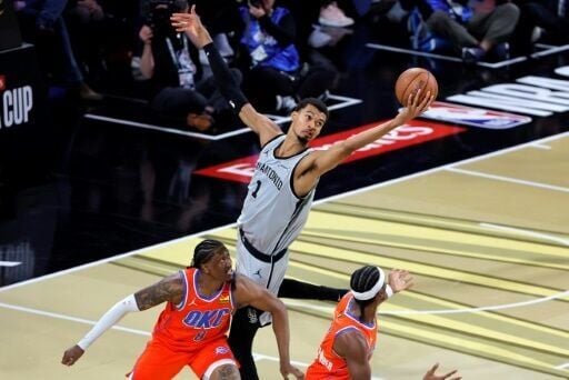 Victor Wembanyama stretches above Oklahoma City's players in San Antonio's upset NBA Cup semi-final win