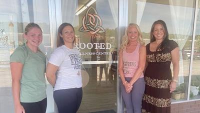 Sarah Beerntsen, second from left, opened Rooted Wellness & Yoga on North Main Street in De Soto in June.