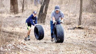 Christian Ahlheim, left, and Luke Meters, both 12 and of St. Louis, participated in the Arnold Stream Team 211’s cleanup in March at Arnold City Park.