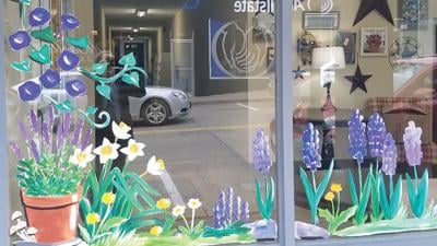 Spring flowers painted on the Twin City Area Chamber of Commerce window.