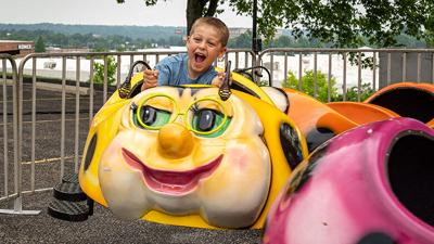 Bennett Bottila, 5, of Imperial enjoys a carnival ride on May 16 during the Holy Family Catholic Parish’s annual picnic in Arnold.