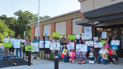 About 40 people attend the Jefferson County Council meeting on June 23 to protest the proposed development of a waste transfer facility in Otto. A group of about two dozen arrive an hour before the meeting to protest outside the Administrative Office in...