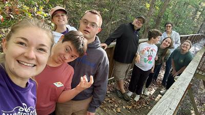 Campers and volunteers at Camp Circle Star go on a hike