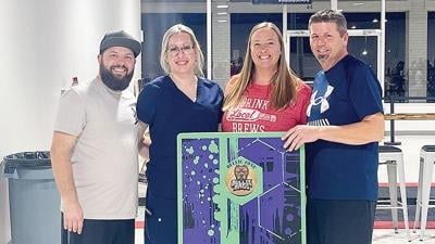 From left, Cornhole Central owners Tommie and Jackie Picha and Melissa and Jason Pennycook.