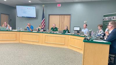 The De Soto Board of Education and Superintendent Ron Farrow, right, discuss the 2025-2026 fiscal year budget.