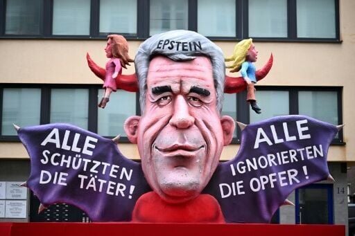 A float of sex offender Jeffrey Epstein reading 'Everyone protects the perpetrators', 'Everyone ignores the victims'