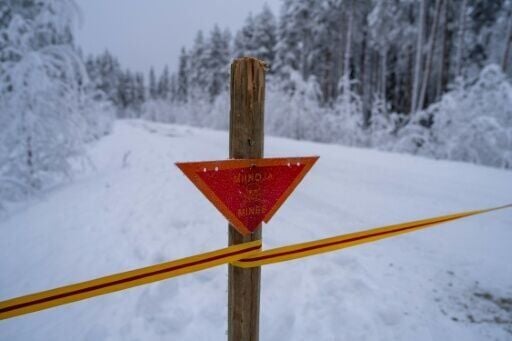 A skull and crossbones in a red triangle is the symbol for a mined area