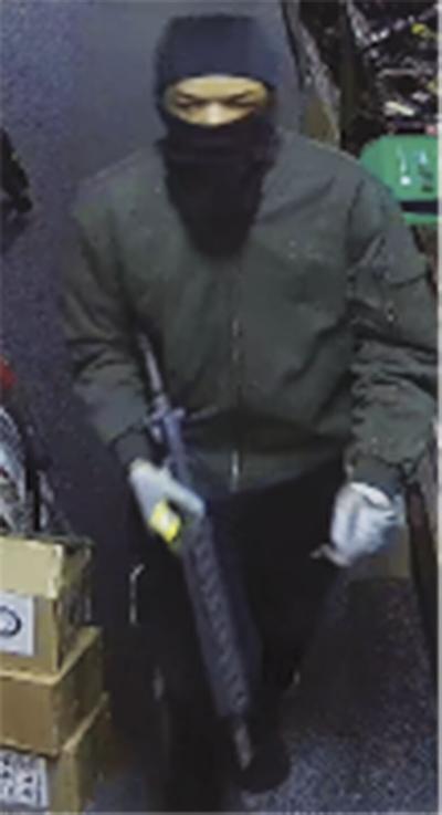 One of the suspects in a recent burglary at the Denny Dennis sporting goods store, where guns were stolen.