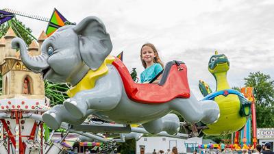 Alyssa Renshaw, 6, of Festus rides a flying elephant during the 37th annual Twin City Firecracker Festival, which was held June 26-27 at Larry G. Crites Memorial Park in Festus.