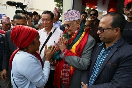 Nepal's ousted prime minister KP Sharma Oli (C) was out campaigning ahead of the March election, which was triggered by anti-corruption protests that toppled his government