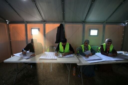 Electoral workers begin the count after voting closed in Deir el-Balah in Gaza