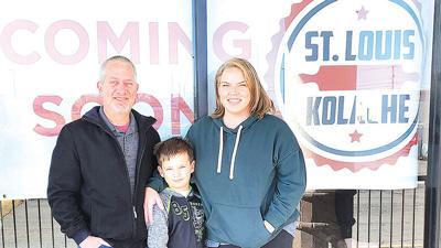 Tim and Jen Heilwagner with son Alex, 7, outside the St. Louis Kolache restaurant the couple plans to open in January at 1249 Water Tower Plaza in Arnold.