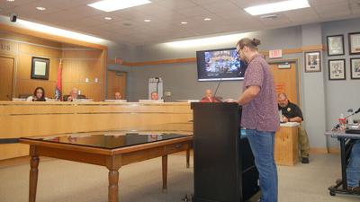 Jordan Compton of Festus speaks against the data center during the remarks of visitors section.