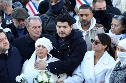 French anti-drug activist Amine Kessaci (C) and his mother Ouassila Benhamdi Kessaci were at the heart of a crowd of people who gathered to pay tribute to 20-year-old Mehdi Kessaci, who died last week in a murder linked to his brother's activism