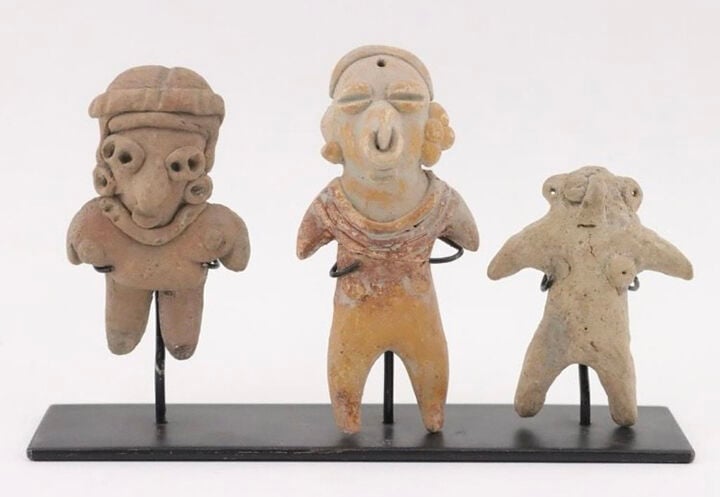 A trio of pre-Columbian pottery standing figures being sold on Drennen’s website under artifacts.