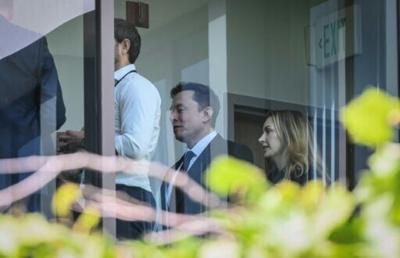 Elon Musk leaves the courtroom at the federal courthouse in Oakland