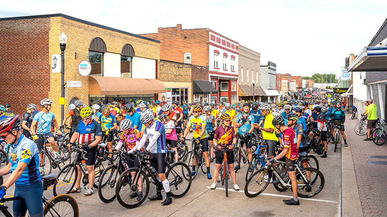 Festus Main Street is packed with bicyclists for the 2024 Bottleneck Bridge Ride.