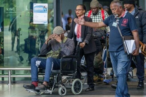 AFP reporters saw the men -- including one in a wheelchair -- exiting the airport of Durban