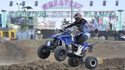 Kristofer Wildhaber of Dittmer rides an ATV at the Jefferson County Fair in Hillsboro.