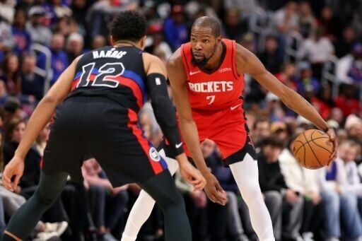 Houston's Kevin Durant looks to get around Tobias Harris in the Rockets' NBA victory over the Detroit Pistons