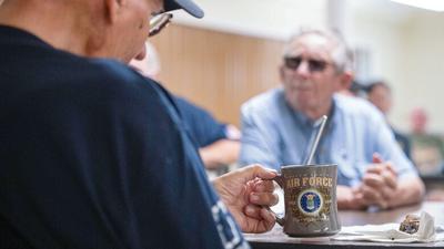 From left, Martin “Bad Marty” Steimell and Wayne Scherell listen to a guest speaker on June 16 at the Big River VFW in Cedar Hill. Steimell is one of a few Air Force veterans in the group, which is made up of people from around the county.