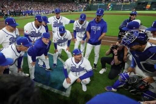 Italy manager Francisco Cervelli celebrates with his players after reaching the World Baseball Classic semi-finals for the first time with a defeat of Puerto Rico