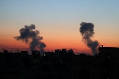 Smoke rises from the site of air strikes in the Iranian capital