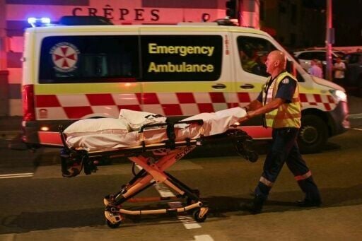 A health worker moves a stretcher after a shooting incident at Bondi Beach in Sydney