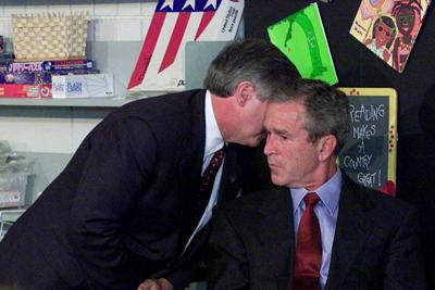 President George W. Bush reacts in a Sarasota, Fla., classroom after being told of the terrorist attacks in New York and Washington on Sept. 11, 2001.