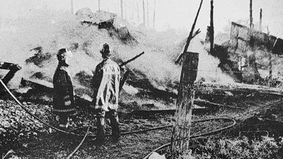 Eureka Fire Protection District firefighters worked to put out a fire in a barn and adjacent building near Allenton in the early 1970s.