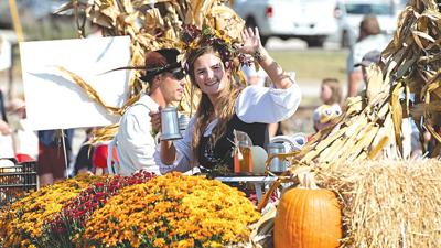 Sarah Allison travels on the Passiglia Landscape, Nursery and Garden float during the Sept. 30 Eureka Days Parade. The three-day festival had an Oktoberfest theme.