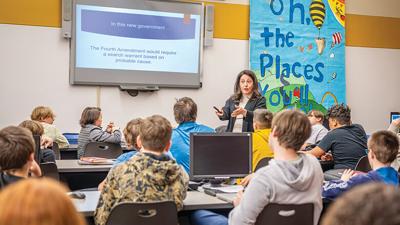 Judge Lisa Page discusses a scenario when a search warrant would be needed with the seventh grade students.